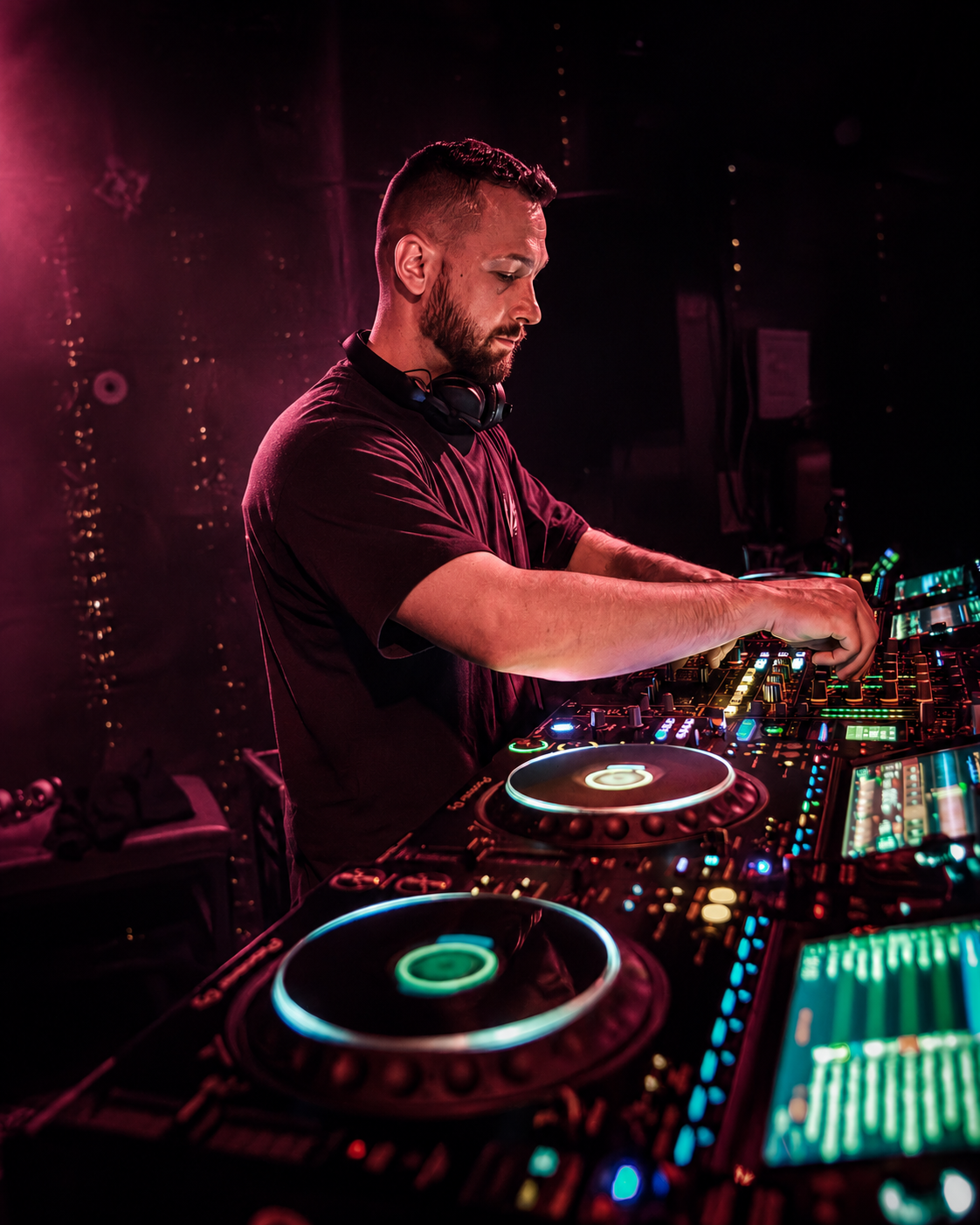 A DJ at the decks at Groove Matters