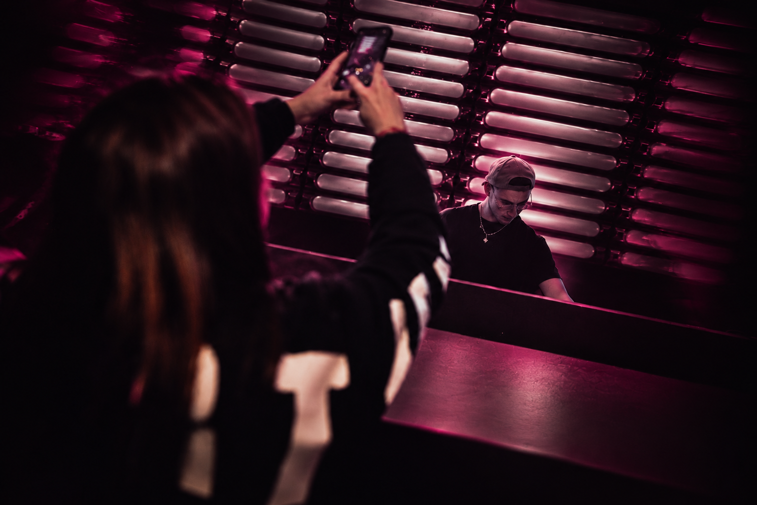 NAAZUK at an earlier performance, with an audience member in the foreground — photographic artwork
